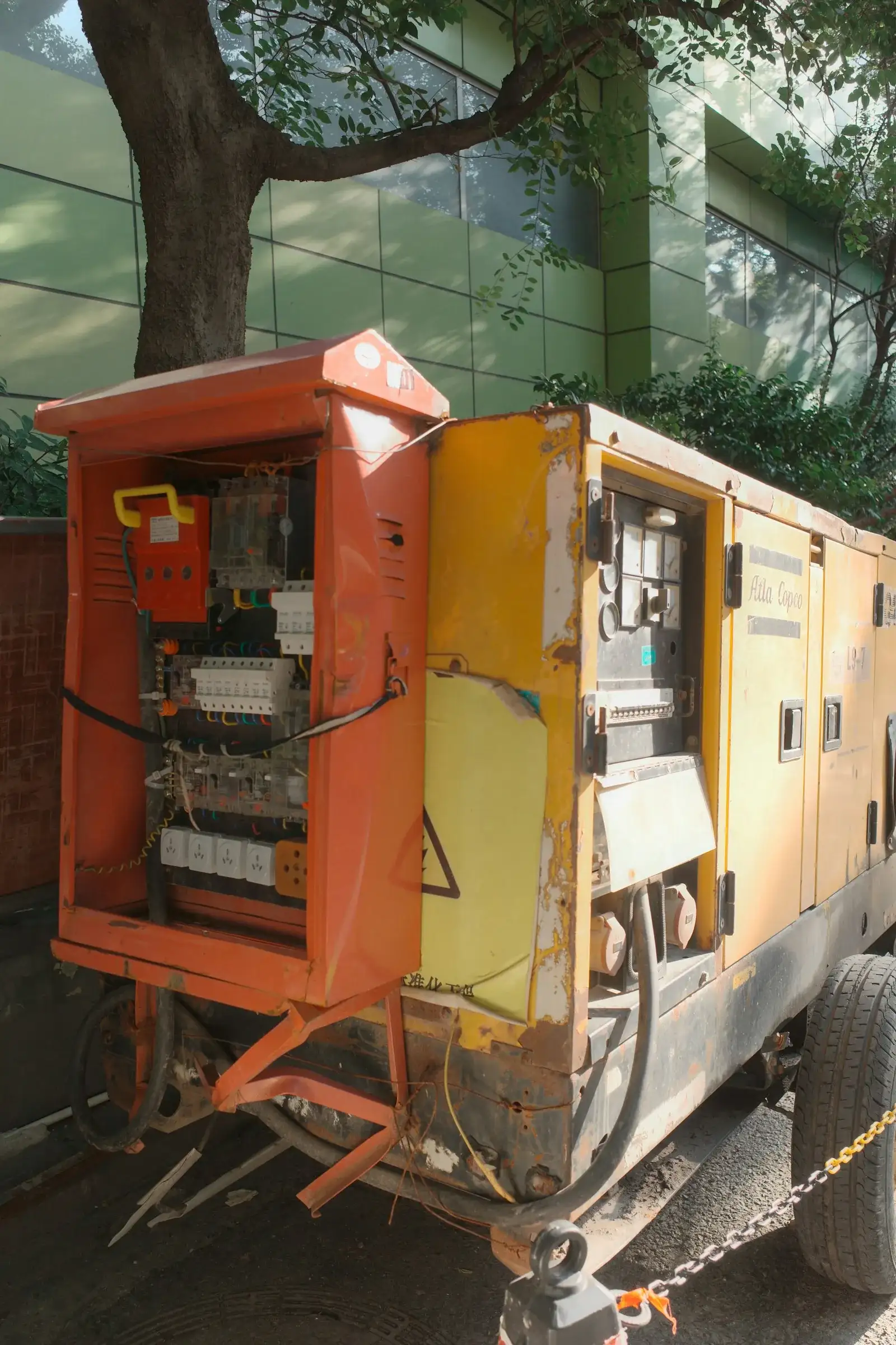 Yellow industrial generator with electrical panel