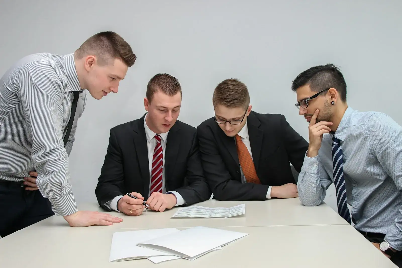 Professional meeting reviewing financial documents