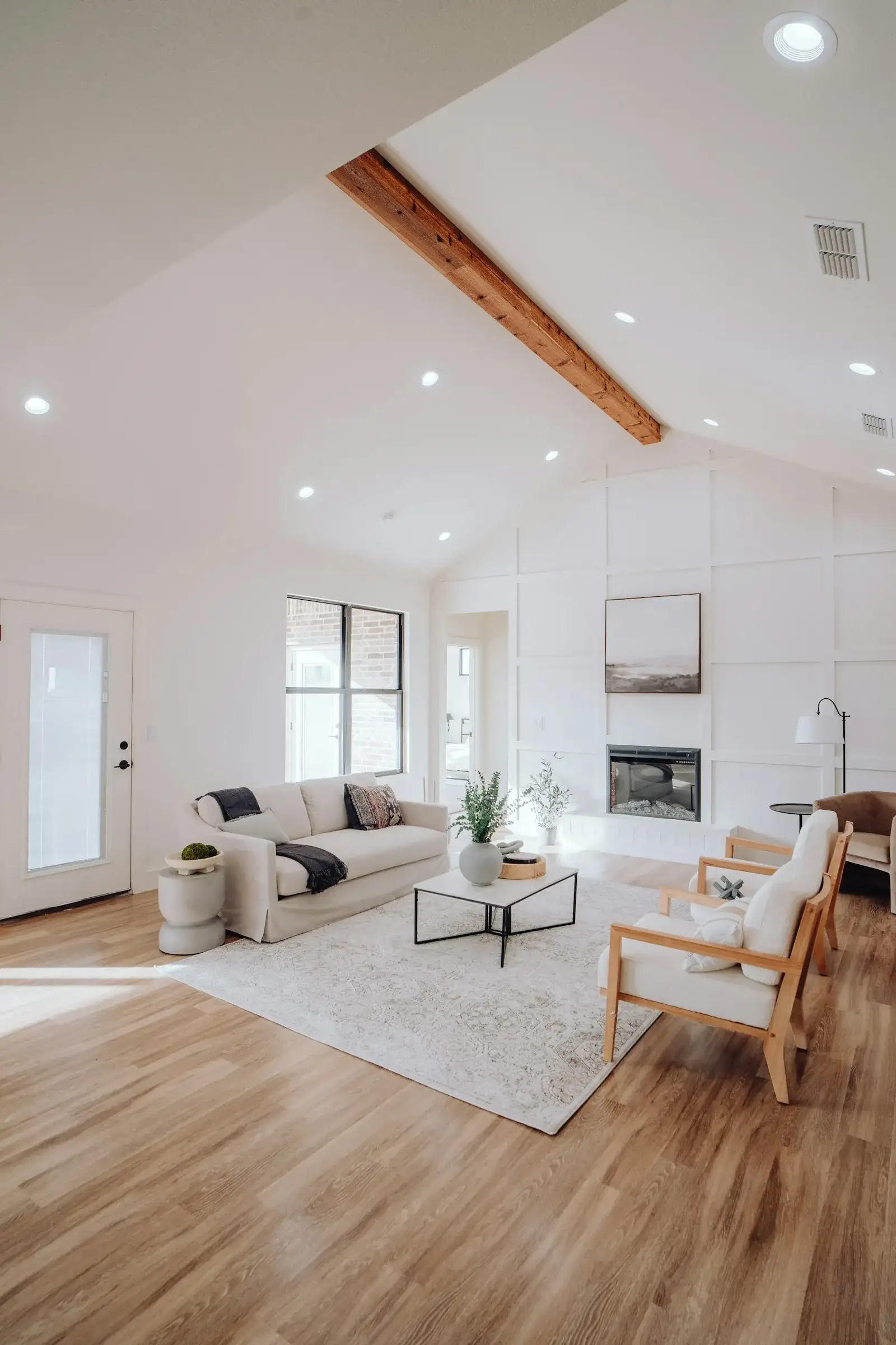 Modern warm living room with lit fireplace